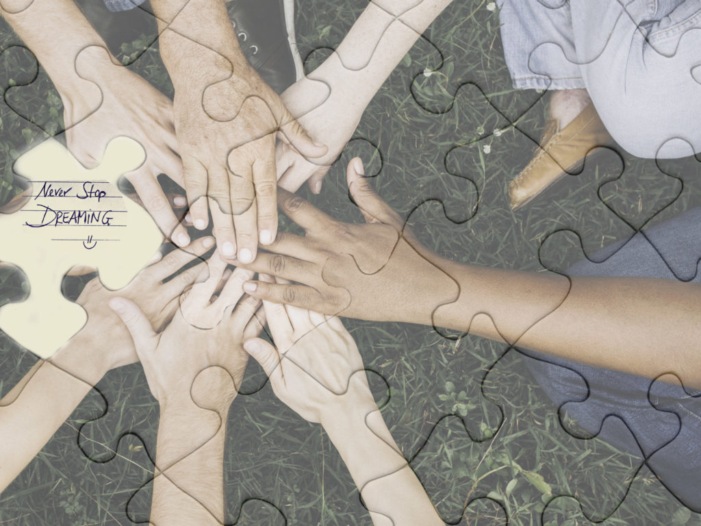 composite image of jigsaw pieces with hands-on a circle for Starting an Erotic Writing Group blog post
